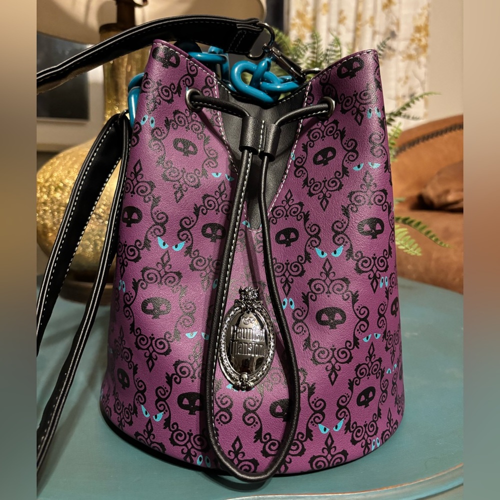 Loungefly Purple and Black Crossbody Bag with Skull Design
